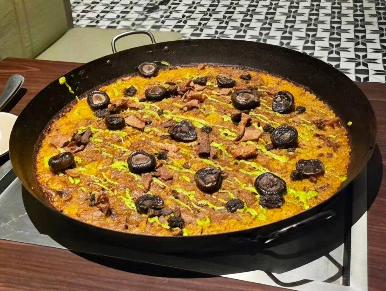 Duck and Truffle Paella with crispy skin chicharon.