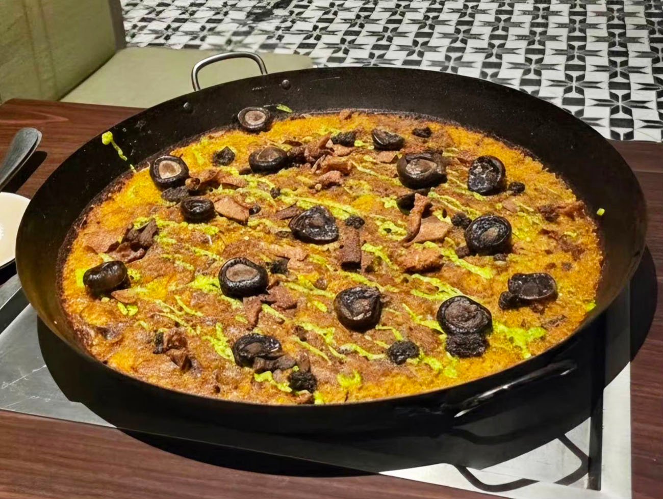 Duck and Truffle Paella with crispy skin chicharon.