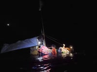 Five rescued in partially submerged boat in Palawan 
