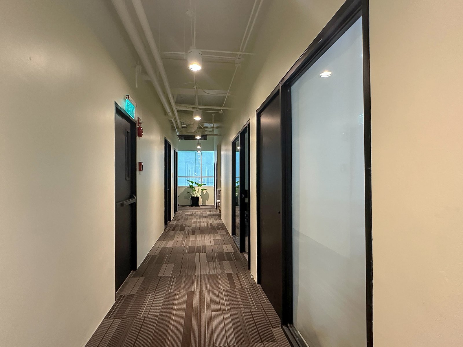 Hallways connect the offices, meeting rooms and shared workspaces.