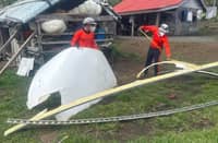 FROM China with love? Philippine Coast Guard personnel secure suspected rocket debris recovered along the shoreline of Barangay Babuyan Claro in Calayan, Cagayan, after residents reported the object washed ashore.