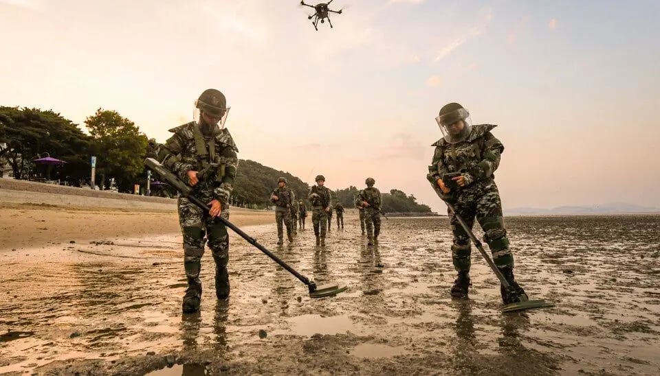 Floods wash landmines into shore