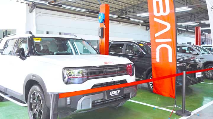 VEHICLES including the BAIC B30e Dune are displayed at the new Cebu dealership.