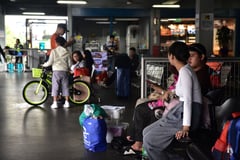 Passengers Await Boarding Amid Heavy Rains in Manila