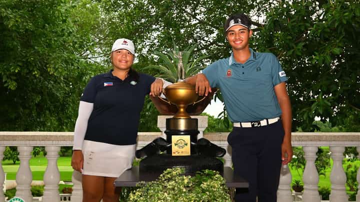 GRACE Quintanilla and Shinichi Suzuki celebrate with the trophy after winning the National Match Play Championship at the Luisita Golf and Country Club on Saturday.