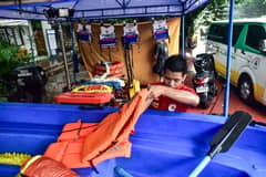 Search and rescue equipment is prepared by a responder on standby at the Manila City Disaster Risk Reduction and Management Office headquarters along Quirino Avenue in Manila on August 8. | Zedrich Xylak Madrid