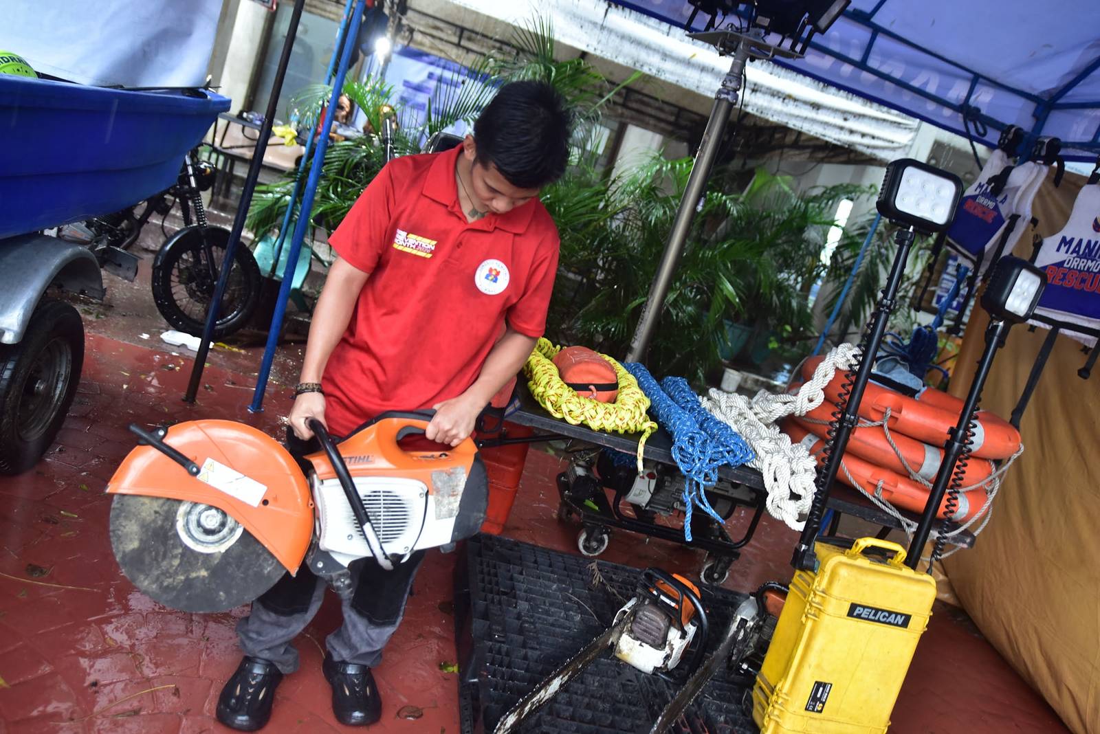 Search and rescue equipment is prepared by a responder on standby at the Manila City Disaster Risk Reduction and Management Office headquarters along Quirino Avenue in Manila on August 8. | Zedrich Xylak Madrid