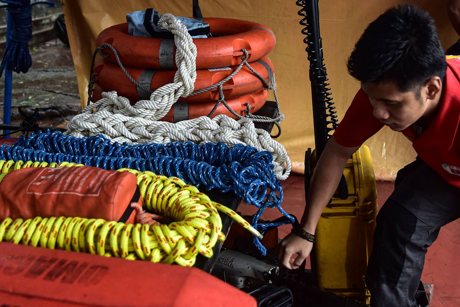 Search and rescue equipment is prepared by a responder on standby at the Manila City Disaster Risk Reduction and Management Office headquarters along Quirino Avenue in Manila on August 8. | Zedrich Xylak Madrid
