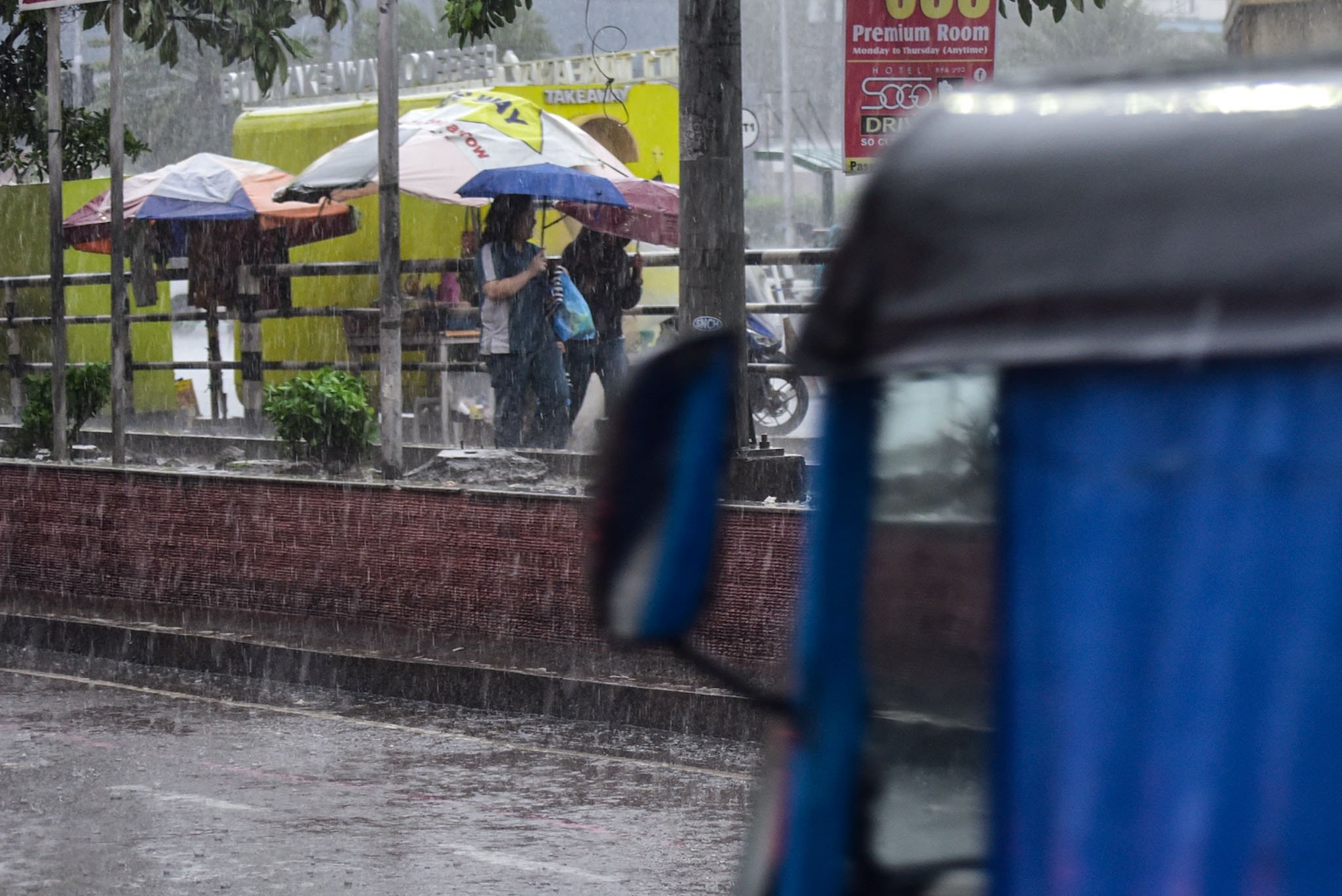 Braving the rain in Pasay City