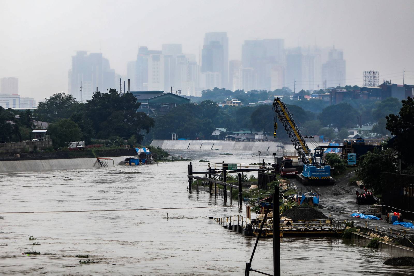 Scenes along the Marikina-Pasig border as Metro Manila remains under a Red Rainfall Warning and the Pasig River rises to 15 cubic meters. | Aram Lascano