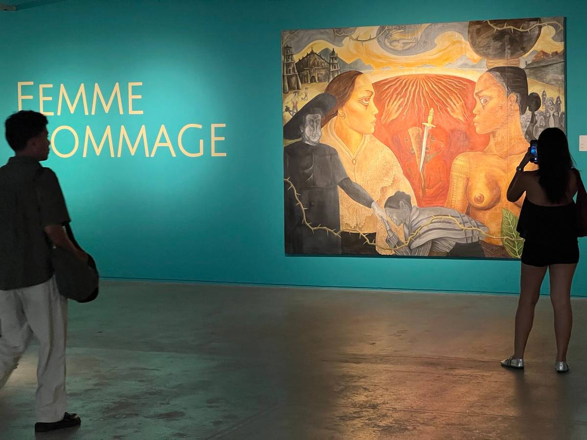 Guests pause to admire Anna Fer’s ‘India at Ilustrada.’