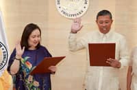 RETIRED Philippine National Police general Rodolfo Azurin (right) swears in Tourism Secretary Dita Angara Mathay as new undersecretary of the Department of Tourism on 4 August in DoT Makati Central Office.