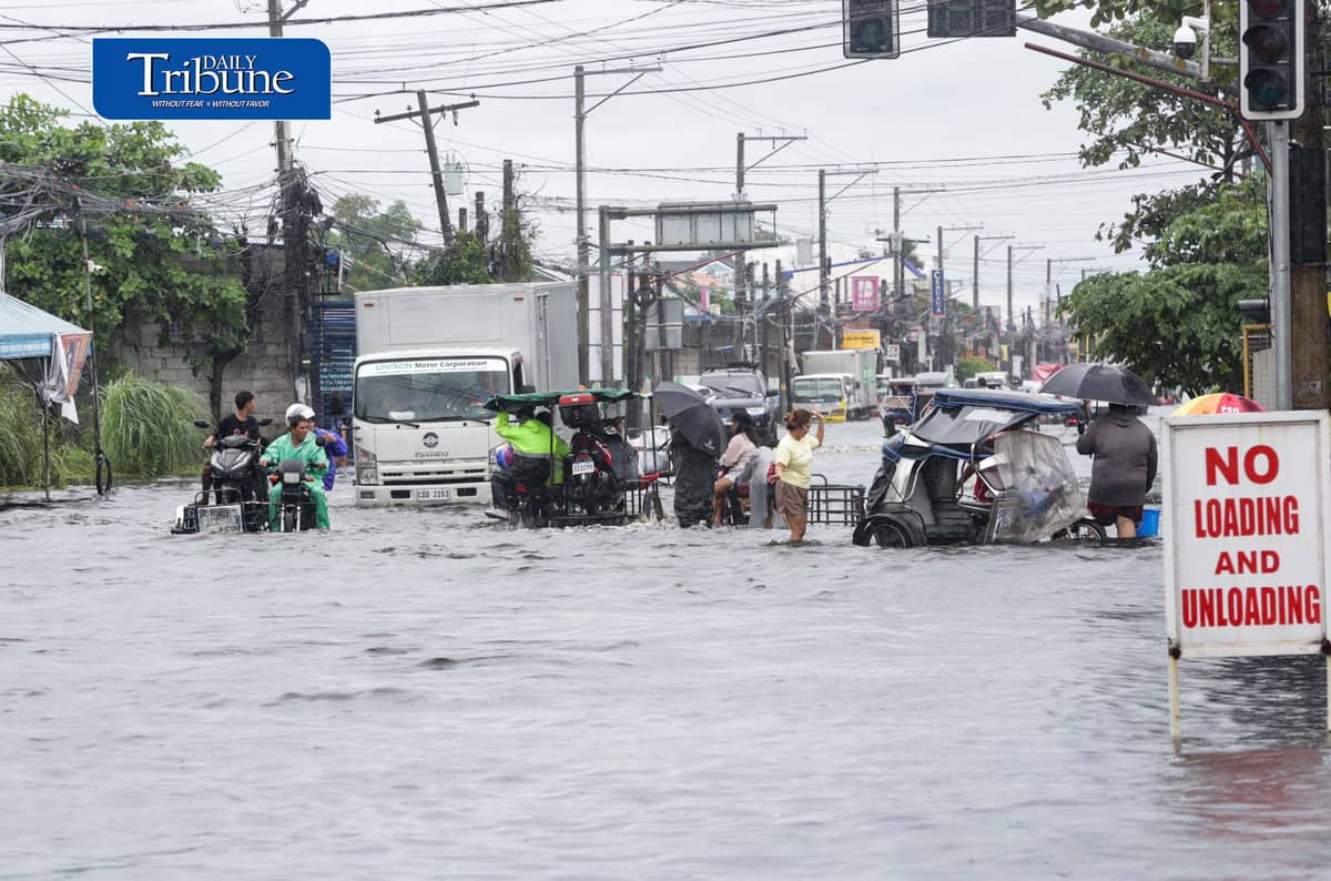 (August 10 2026) Motorists bravely navigated the flood along the Mc Arthur Highway, in Brgy Sta Monica, San Simon, Pampanga, on Monday August 10 2026. Pagasa bureau said southwest monsoon, locally known as habagat, will still prevail over parts of Luzon and Visayas, possible flash floods or landslides due to moderate to heavy rains. Photo/Analy Labor