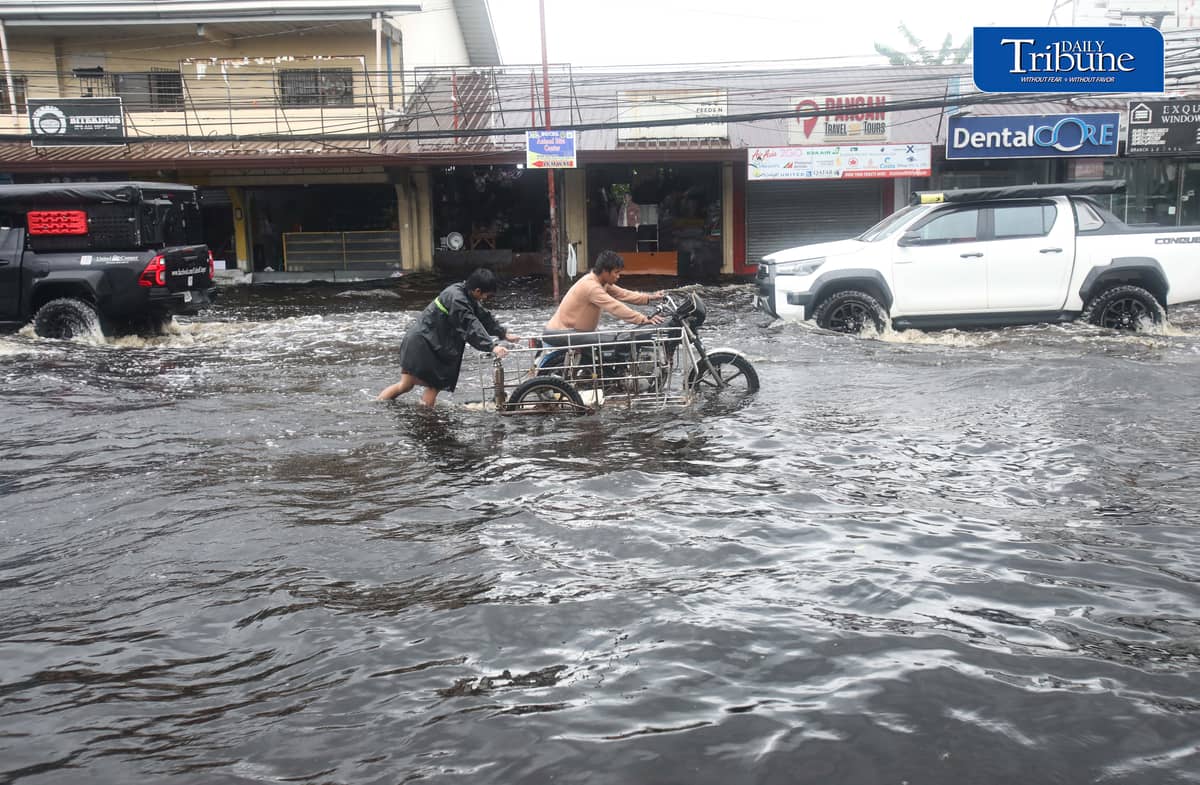 (August 10 2026) Motorists bravely navigated the flood along the Mc Arthur Highway, in Brgy Sta Monica, San Simon, Pampanga, on Monday August 10 2026. Pagasa bureau said southwest monsoon, locally known as habagat, will still prevail over parts of Luzon and Visayas, possible flash floods or landslides due to moderate to heavy rains. Photo/Analy Labor