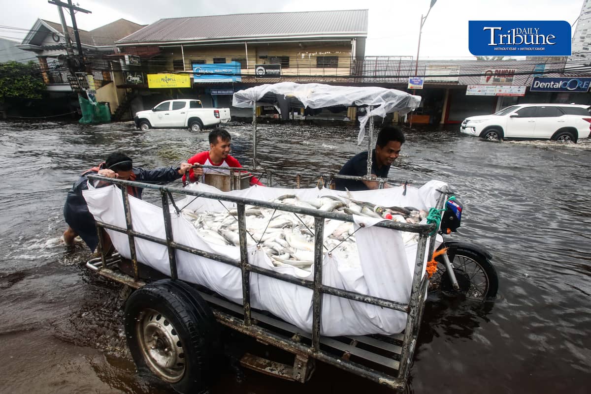 (August 10 2026) Motorists bravely navigated the flood along the Mc Arthur Highway, in Brgy Sta Monica, San Simon, Pampanga, on Monday August 10 2026. Pagasa bureau said southwest monsoon, locally known as habagat, will still prevail over parts of Luzon and Visayas, possible flash floods or landslides due to moderate to heavy rains. Photo/Analy Labor