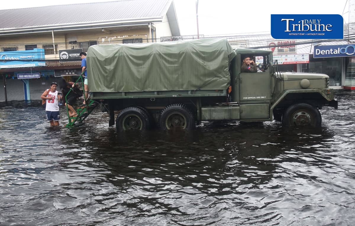 (August 10 2026) Army 6x6 truck conducted a free ride passing along Mc Arthur Highway in San Simon Pampanga to help commuters stranded due to flood brought by the enhanced southwest monsoon, on Monday August 10 2026. Photo/Analy Labor