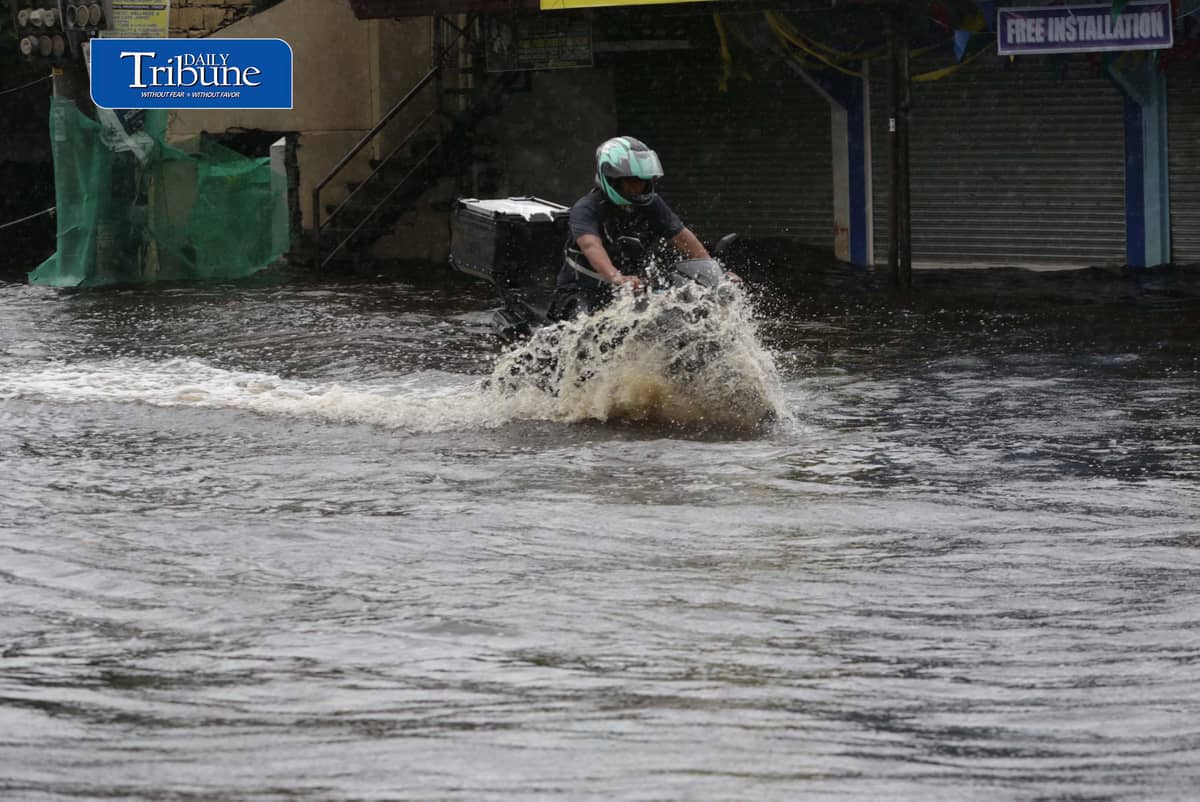 (August 10 2026) Motorists bravely navigated the flood along the Mc Arthur Highway, in Brgy Sta Monica, San Simon, Pampanga, on Monday August 10 2026. Pagasa bureau said southwest monsoon, locally known as habagat, will still prevail over parts of Luzon and Visayas, possible flash floods or landslides due to moderate to heavy rains. Photo/Analy Labor