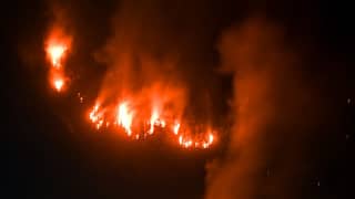 Wildfire flames and smoke rise above a forest in Bromo Tengger Semeru National Park near Mount Bromo in Probolinggo, East Java, Indonesia, on 10 August 2026.
