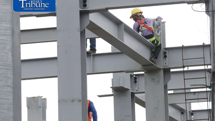 (August 11 2026) Workers balance themselves as the work at the ongoing construction building in Quezon City, As of August 11, 2026, the ₱85 Metro Manila wage increase under Wage Order No. NCR-27 remains halted due to a Temporary Restraining Order (TRO) issued by the Pasig Regional Trial Court. Photo/Analy Labor