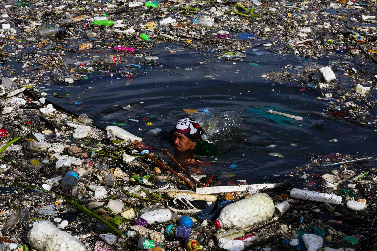 Estero rangers from the DPWH, MMDA, DENR and Parañaque City clear tons of garbage trapped in a drainage channel in Baclaran on 11 August 2026. The multi-agency flood-mitigation operation aims to reduce urban flooding following torrential rains brought by the southwest monsoon. Department of Public Works and Highways Secretary Vince Dizon oversees the clearing operations.