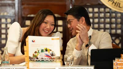 Nueva Ejica Rep. Mikaela Angela Suansing and House Speaker Faustino "Bojie" Dy during the ceremonial turnover of the 2027 National Expenditure Program to the House of Representatives on Tuesday, 11 August 2026.