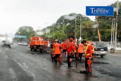 (August 11 2026) Department of Public Work and Highways (DPWH) workers saw asphalt the potholes caused by the continuous rain brought by Southwest monsoon, along Commonwealth Avenue in Brgy. Central, Quezon City, on Tuesday August 11 2026. Photo/Analy Labor