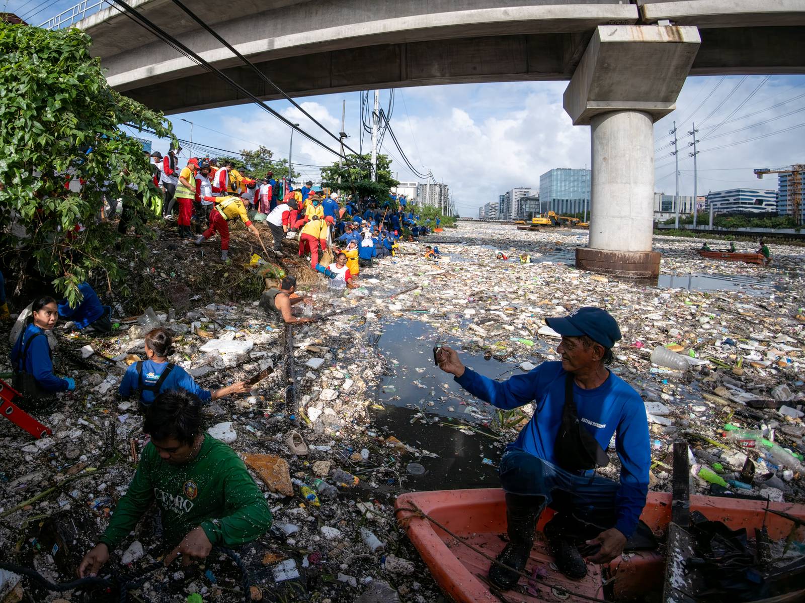 Estero rangers from the DPWH, MMDA, DENR and Parañaque City clear tons of garbage trapped in a drainage channel in Baclaran on 11 August 2026. The multi-agency flood-mitigation operation aims to reduce urban flooding following torrential rains brought by the southwest monsoon. Department of Public Works and Highways Secretary Vince Dizon oversees the clearing operations.
