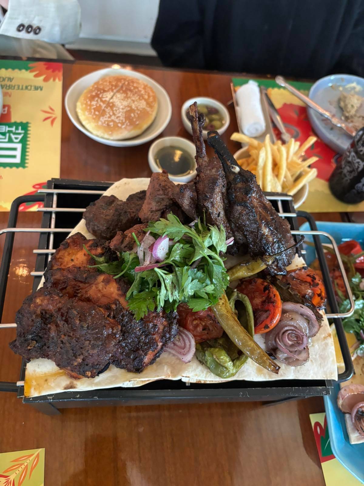 MASHWI Grill is served with Fries, garlic sauce and tartar sauce.