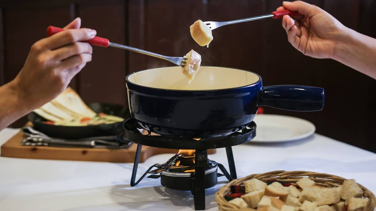 Old Swiss Inn's classic (and ver craveable) Waatlander Fondue is made with melted Gruyere and Emmenthal cheese, and comes with bread cubes for dipping.