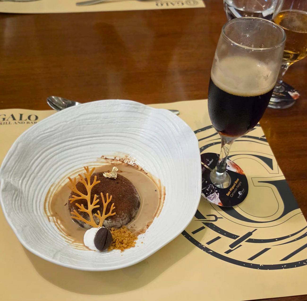 Dark chocolate fondant with expresso creme anglaise paired with San Miguel Negra.