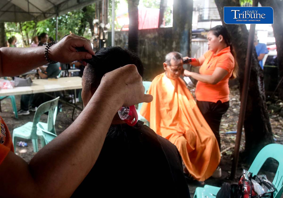 (August 15 2026) Residents in Barangay 178 in Caloocan avail free hair cut, during the medical mission conducted by the Caloocan Local Government on Saturday August 15, 2026. The  aim of the mission is to bring free services closer to the residents, due to the continuous rain, and residents unable to go out, they can avail such as medical check up, dental, eyes, ECG, FBS, blood type, free hair cut, and anti rabies vaccine for the pets. Photo/Analy Labor