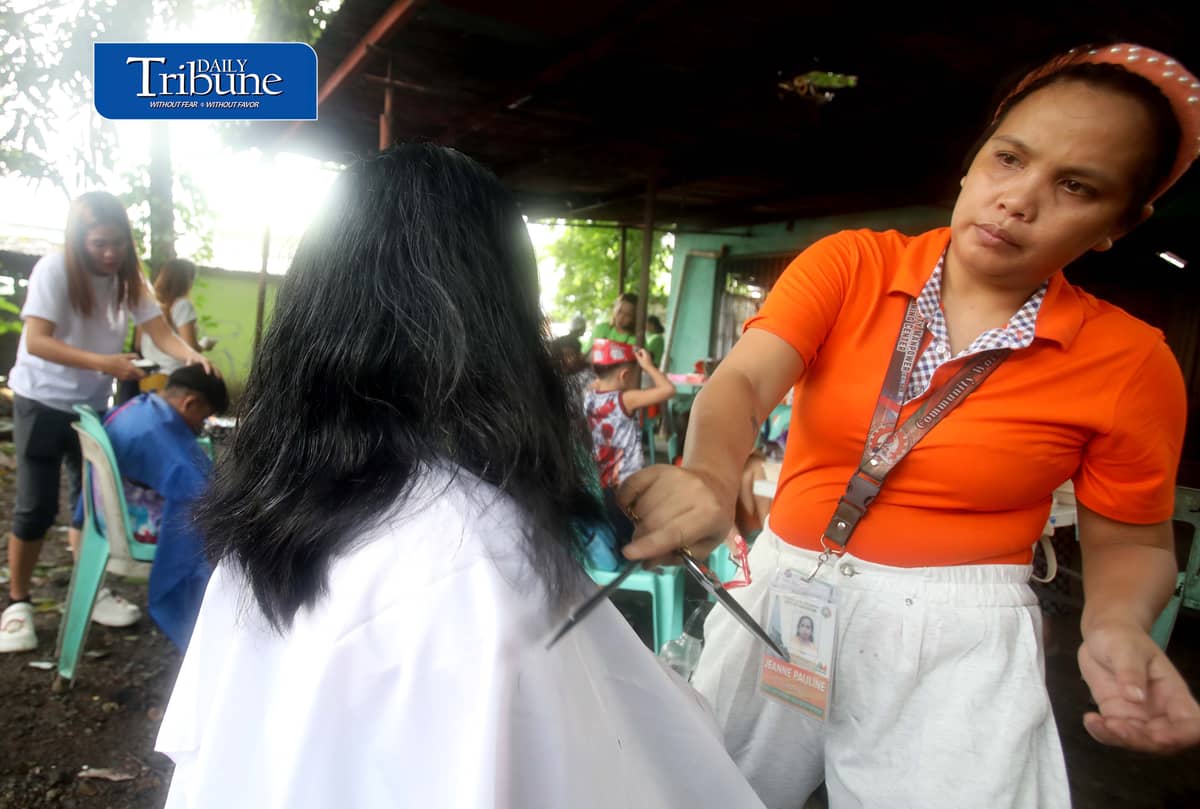 (August 15 2026) Residents in Barangay 178 in Caloocan avail free hair cut, during the medical mission conducted by the Caloocan Local Government on Saturday August 15, 2026. The  aim of the mission is to bring free services closer to the residents, due to the continuous rain, and residents unable to go out, they can avail such as medical check up, dental, eyes, ECG, FBS, blood type, free hair cut, and anti rabies vaccine for the pets. Photo/Analy Labor