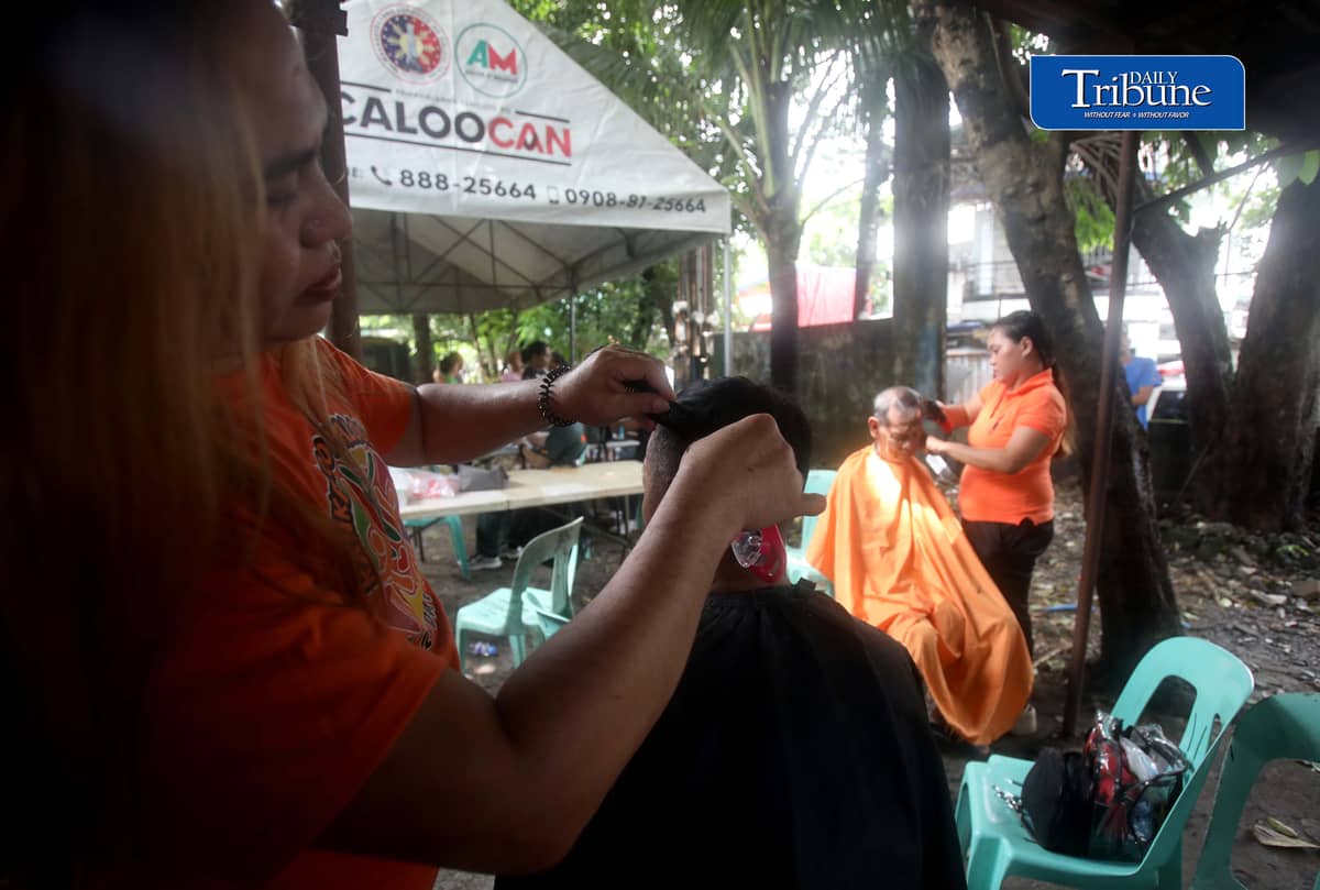 (August 15 2026) Residents in Barangay 178 in Caloocan avail free hair cut, during the medical mission conducted by the Caloocan Local Government on Saturday August 15, 2026. The  aim of the mission is to bring free services closer to the residents, due to the continuous rain, and residents unable to go out, they can avail such as medical check up, dental, eyes, ECG, FBS, blood type, free hair cut, and anti rabies vaccine for the pets. Photo/Analy Labor