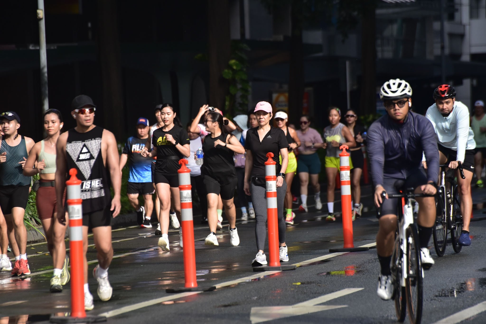 Joggers brave torrential rain along Ayala Avenue