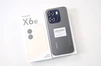 HONOR X6e box with the phone placed on top, showcasing the device alongside its packaging.