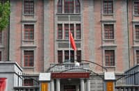 China’s national flag flies at half-mast to mourn the death of former Premier Zhu Rongji at the Red Building of Peking University in Beijing.