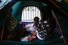 Residents take shelter at Manila school