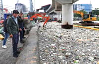 PRESIDENT Ferdinand R. Marcos Jr. inspects the ongoing clearing and waste collection operations at the Redemptorist Water Channel in Parañaque City on Wednesday, where a ‘sea of trash’ accumulated amid heavy rains brought by the southwest monsoon or habagat.