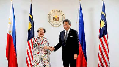 FOREIGN Affairs Secretary Ma. Theresa P. Lazaro and Malaysian Foreign Minister Dato' Seri Utama Haji Mohamad Bin Haji Hasan at the 9th Philippines-Malaysia Joint Commission Meeting on 18 August 2026, at the Department of Foreign Affairs in Manila. The Malaysian Foreign Minister said the 9.5 percent increase in trade between the Philippines and Malaysia from January to May are keeping both countries on course in hitting their $10-billion bilateral trade target.
