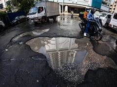 Potholes along Plaza Cervantes