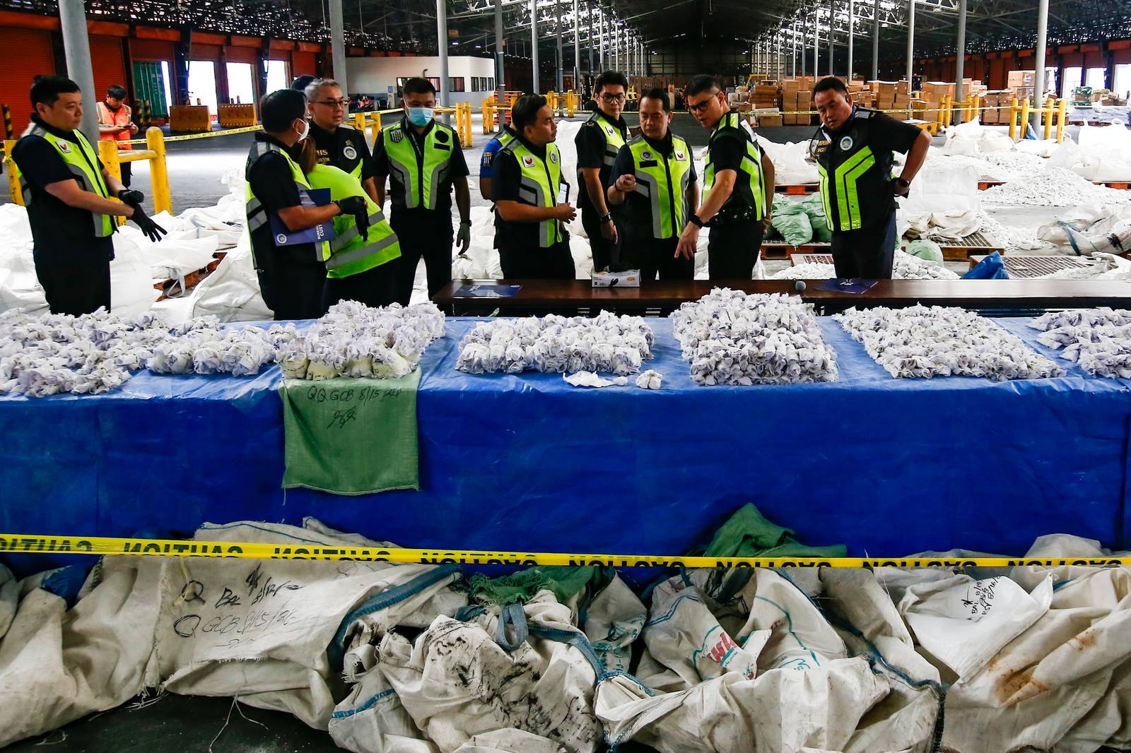 Bureau of Customs Commissioner Ariel Nepomuceno together with The Philippine Drug Enforcement Agency leads the inspection of seized methamphetamine hydrochloride, locally known as “shabu,” at the Manila International Container Port (MICP) in Tondo, Manila, on 20 August 2026. The shipment consisting of two 20-footer container van from Afghanistan is concealed in bags designed to look like talc stones. The uncovered prohibited drugs which is approximately 43 kilograms, is estimated worth 292.4 million pesos.