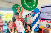 A young lifter tests the weightlifting equipment donated by the Philippine Sports Commission to the Hidilyn Diaz Weightlifting Gym in Zamboanga City.