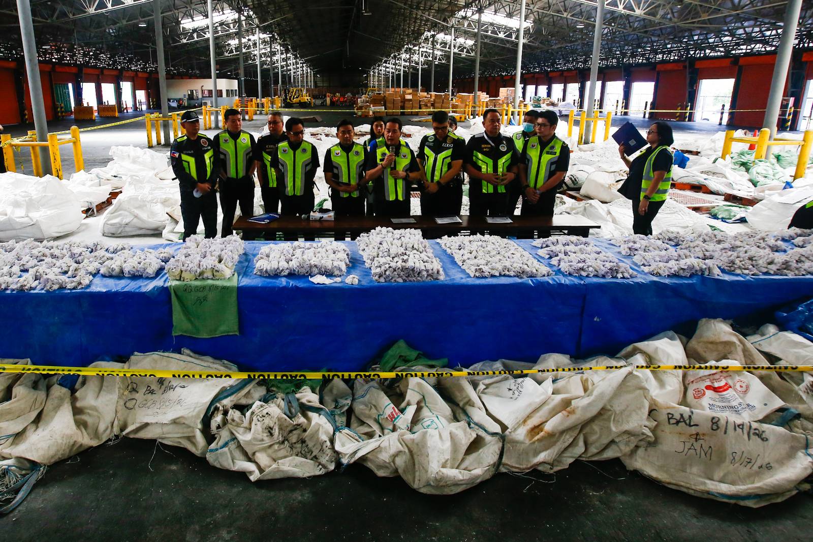 Bureau of Customs Commissioner Ariel Nepomuceno together with The Philippine Drug Enforcement Agency leads the inspection of seized methamphetamine hydrochloride, locally known as “shabu,” at the Manila International Container Port (MICP) in Tondo, Manila, on 20 August 2026. The shipment consisting of two 20-footer container van from Afghanistan is concealed in bags designed to look like talc stones. The uncovered prohibited drugs which is approximately 43 kilograms, is estimated worth 292.4 million pesos.