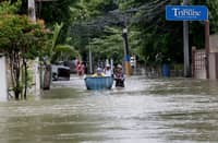 Residents of Barangays San Juan, Sta. Ana, and Palapat in Hagonoy, Bulacan walk through waist-deep floodwaters on Saturday, August 22, 2026. According to residents, they have been enduring the floods for two weeks, blaming an unfinished floodgate structure in Barangay Iba, Hagonoy, which was supposed to help but ended up blocking the flow of floodwater. Photo by Analy Labor