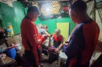 MEDICAL personnel attend to one of the two fishermen rescued by the Philippine Coast Guard after they went missing in the waters of Balayan Bay, Batangas, on 20 August.