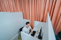 A call center representative attends to a call from a customer during the opening of BPO firm XP Plus Solutions Inc. in Danao City, Cebu, the first in the said city.