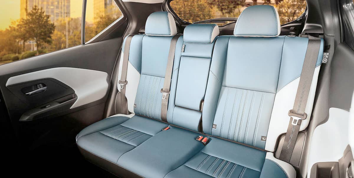 REAR passengers get a three-seat bench with blue-and-white upholstery and adjustable headrests in the all-new Nissan Kicks e-Power.