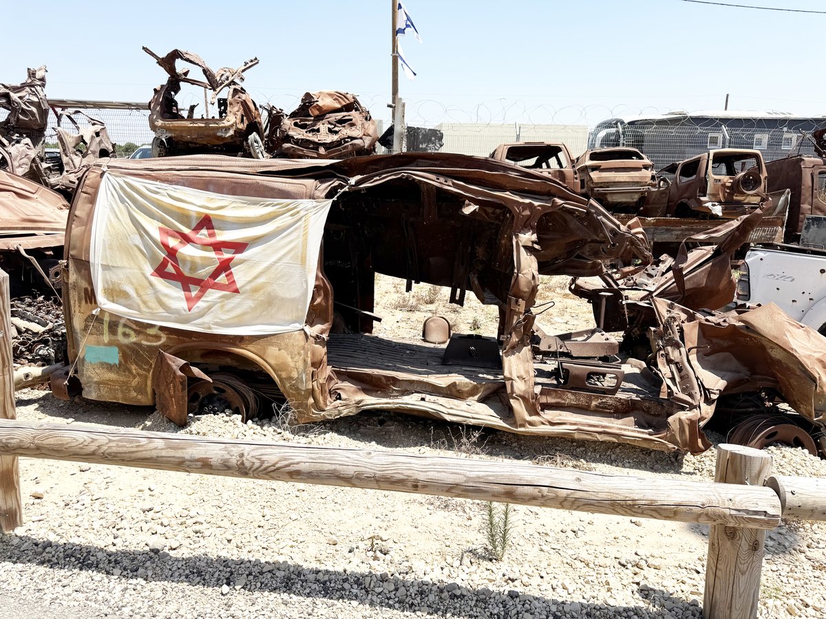 BURNED-OUT vehicles from the 7 October attacks have been stacked in commemoration of the carnage seen during that fateful day.