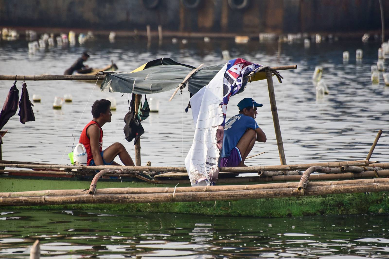 Floating plastic bottles are used as markers to indicate a line of wild green sea mussels in Cavite City, on August 24

Fishermen say plastic bottles can harm the ocean and prefer bamboo as a more sustainable buoyant marker. l Zedrich Xylak Madrid