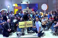 UnionBank representatives, Tahanang Walang Hagdanan Inc. beneficiaries and community partners pose for a photo after watching Charlie and the Chocolate Factory: The Musical at The Theatre at Solaire.